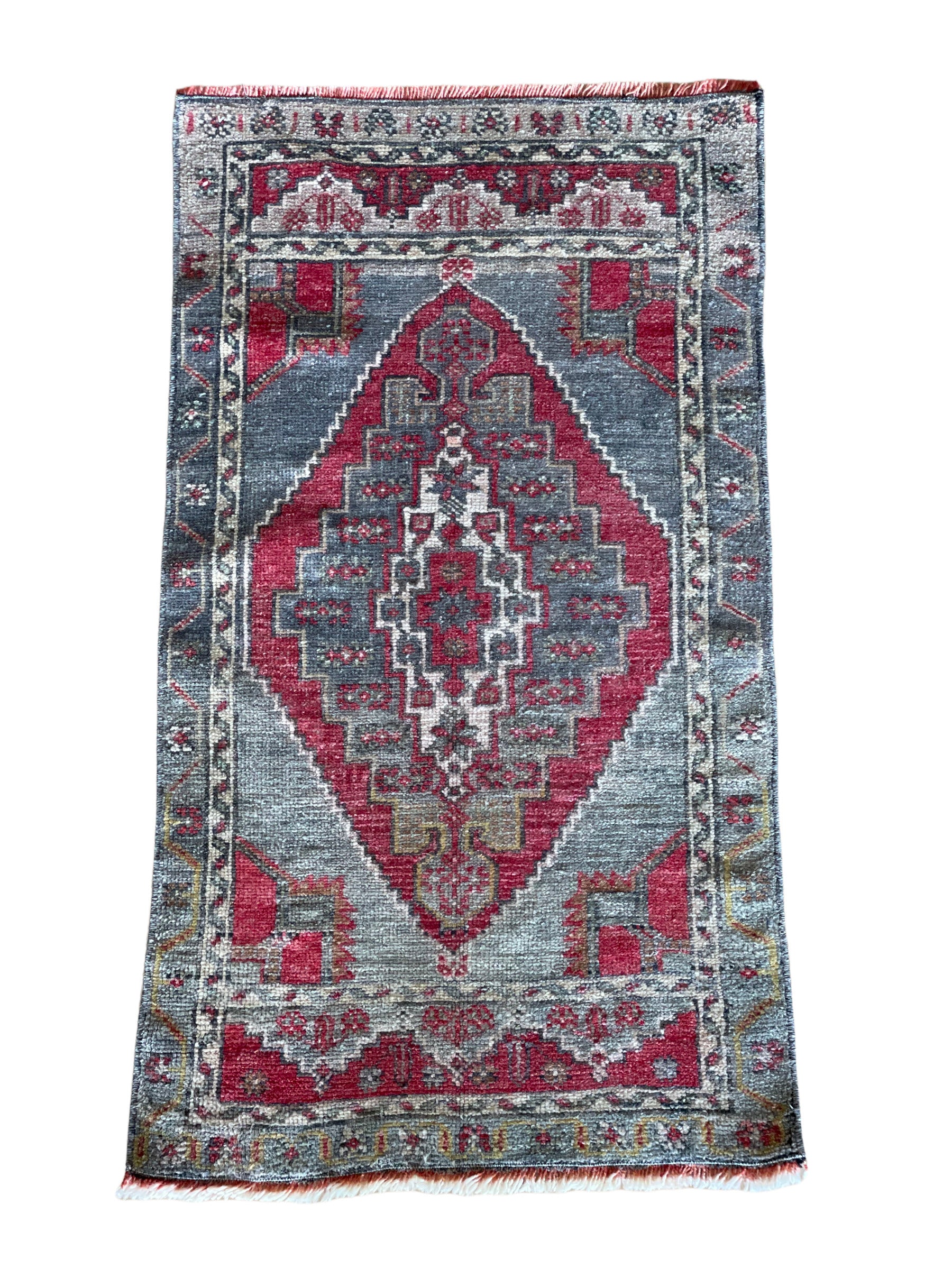 Semi-Antique wool hand knotted rug with red and grey coloring.